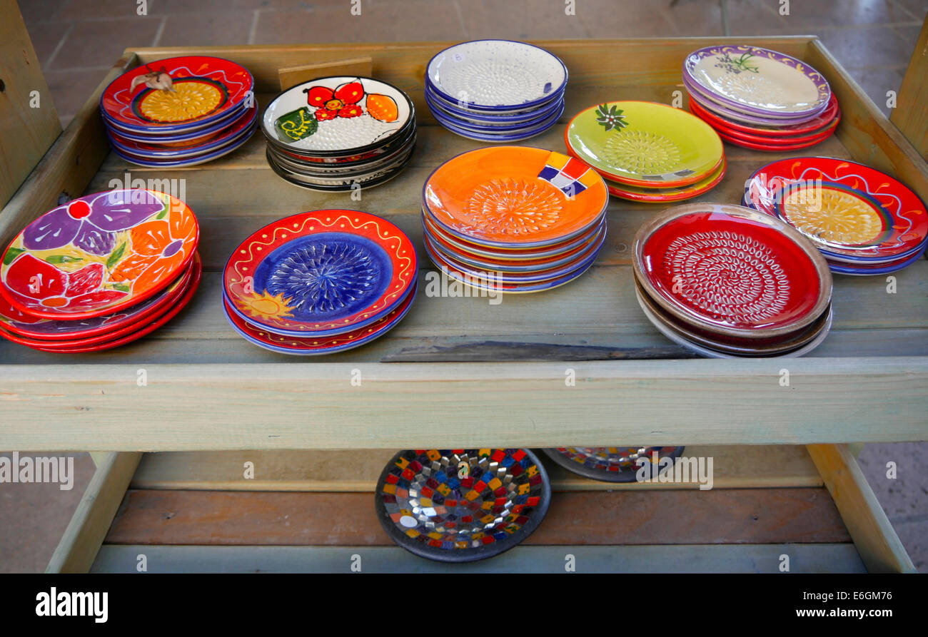 Colourful French pottery and stoneware on sale in the town of Mirepoix, Ariege, France Stock Photo