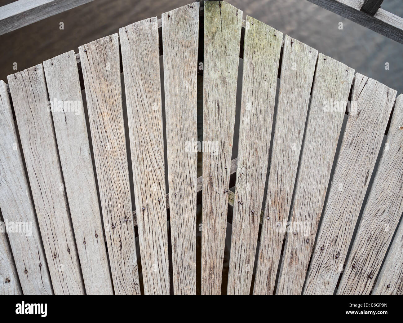 This photo displays the flooring design of a turn on a wooden bridge. Stock Photo