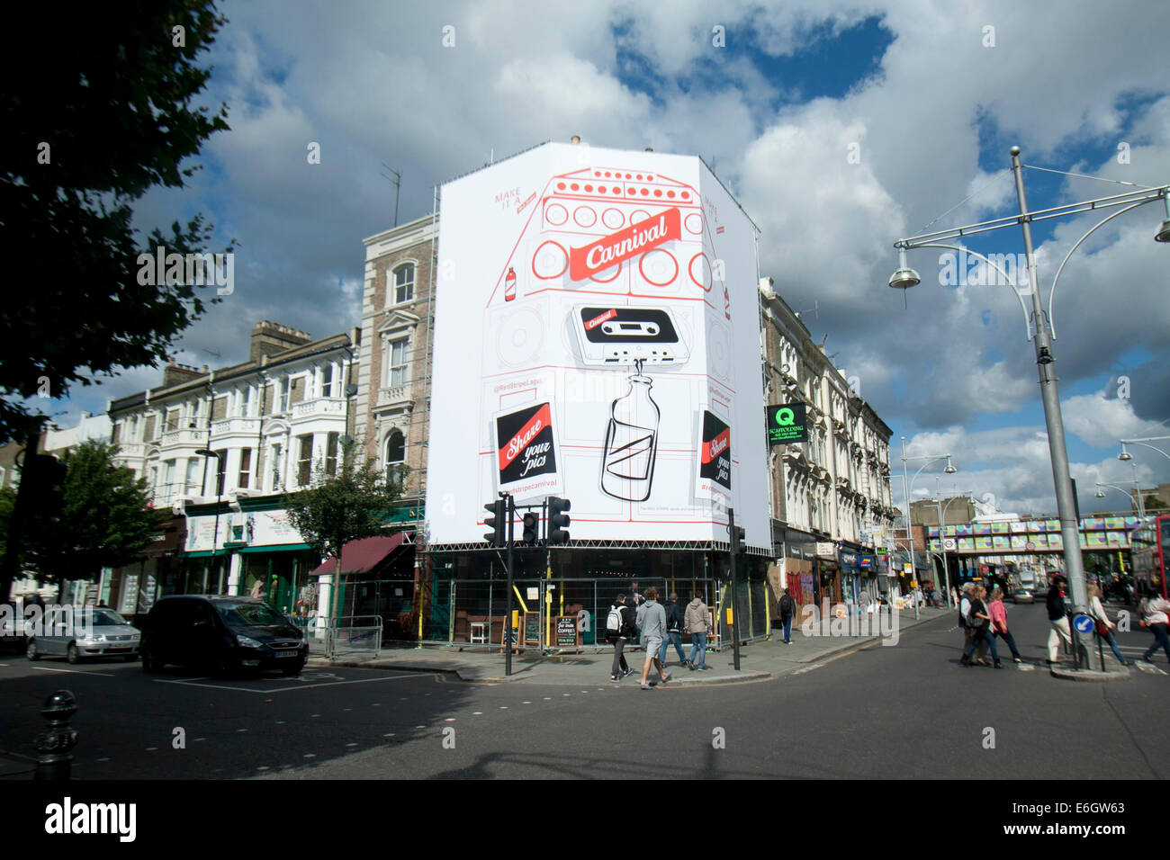 London Uk 23rd August 14 A Giant Billboard Advertising Jamaican Beer Red Stripe Residents Board Up Properties And Shops Ahead Of The Notting Hill Carnival The Largest Street Festival In Europe Which Is