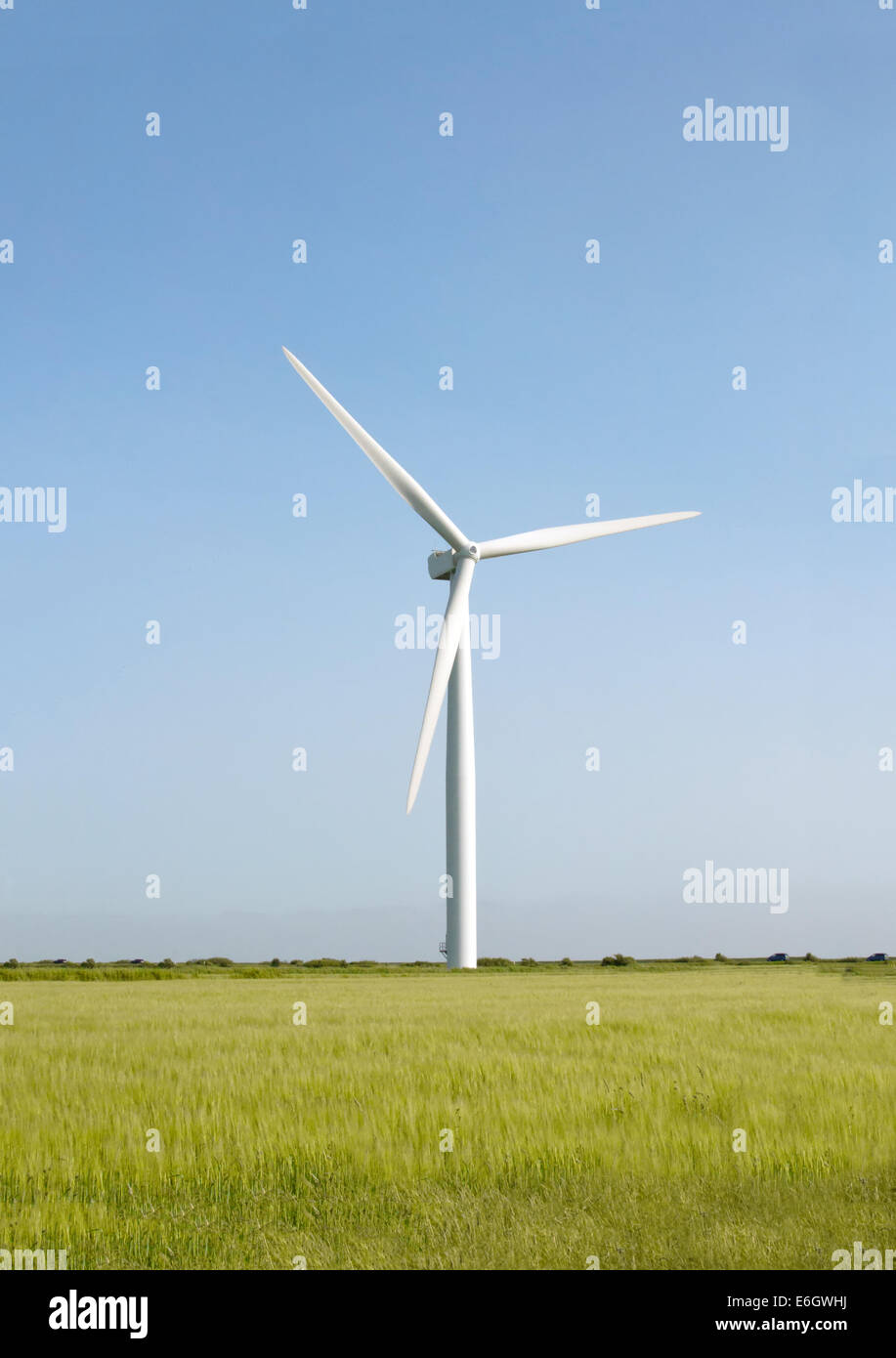Wind turbine against clean blue sky Stock Photo - Alamy