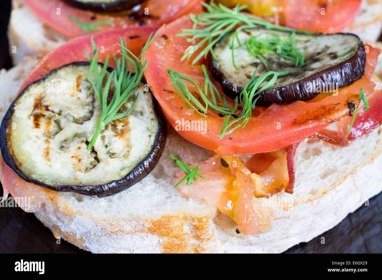 Sandwich with bacon, tomato and eggplant Stock Photo Alamy