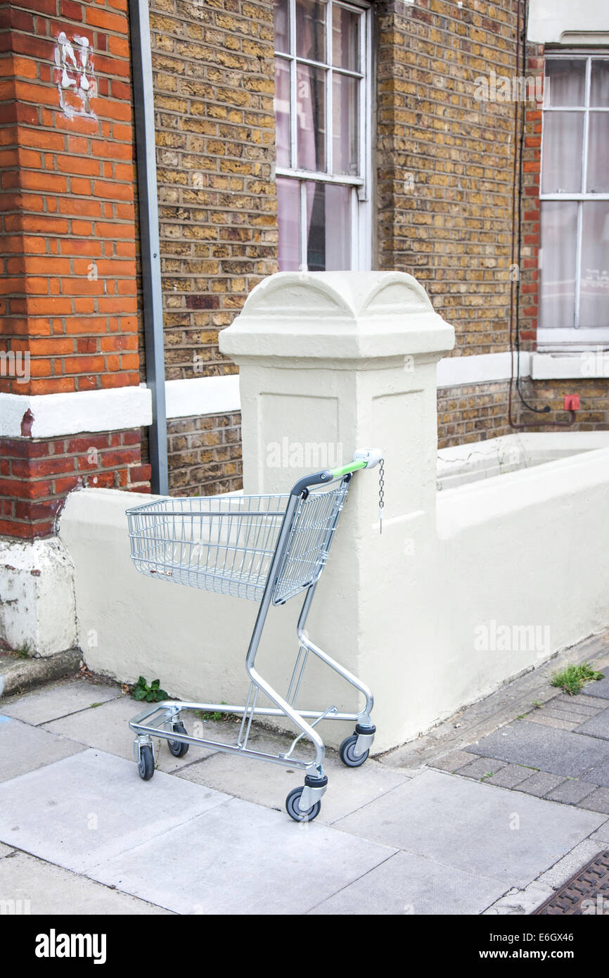 Abandoned shopping trolley on the street Stock Photo