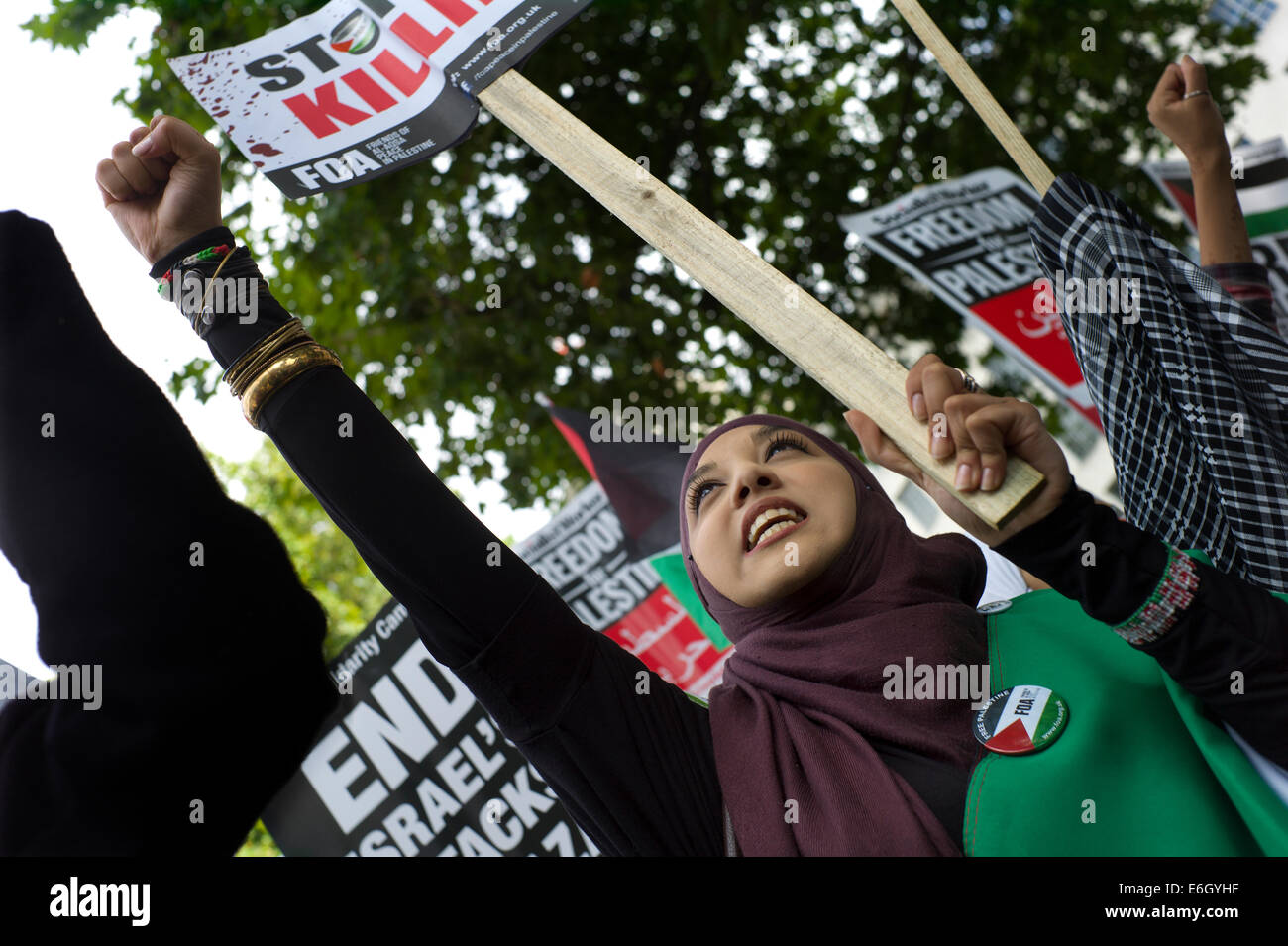 London, UK. 23rd August, 2014. Free Palestine and Free Gaza anti Israeli Demonstration opposite Prime Minister Cameron's residence Downing Street in Whitehall, London EnglandUK. 23 August 2014 The peaceful demostration was interupted very briefly by a pro Israeli demonstrator with a flag showing the Star of David. Credit:  BRIAN HARRIS/Alamy Live News Stock Photo