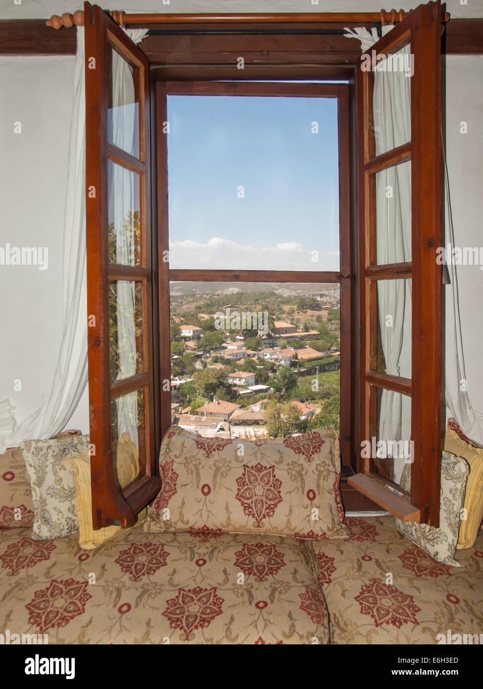 view through the window of a traditional ottoman living room over the village of sirince izmir turkey Stock Photo