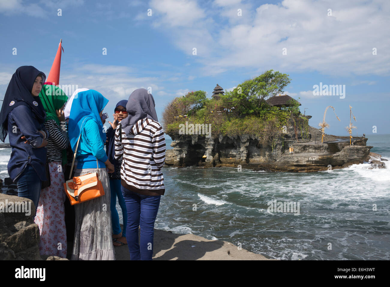Group of girls visiting Tanah Lot Temple Bali Indonesia Stock Photo