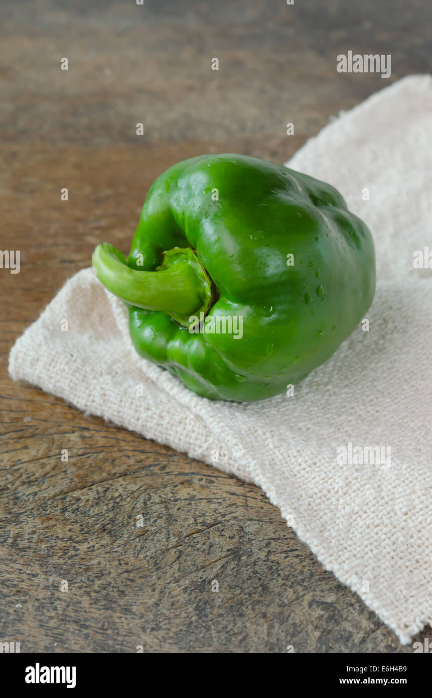 fresh vegetable , green  bell peppers on wooden table Stock Photo