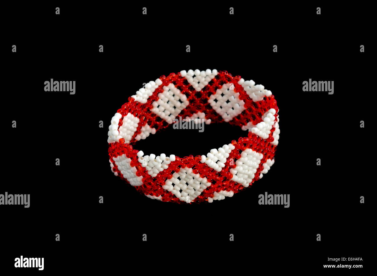 Traditional bulgarian adornment for forearm from white and red bead. Stock Photo