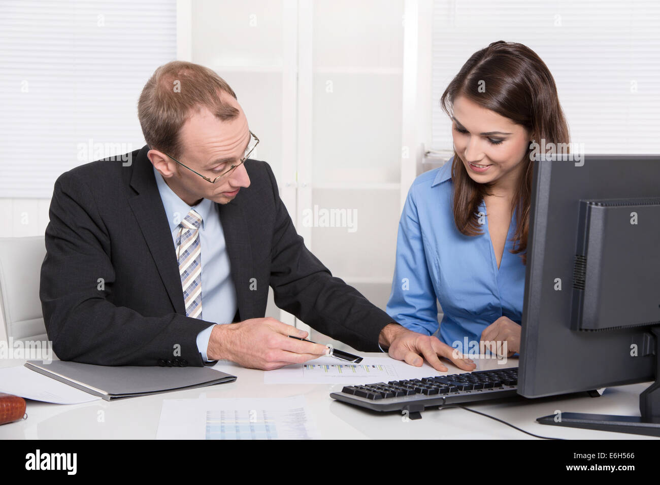Successful team in the office - man and woman. Stock Photo