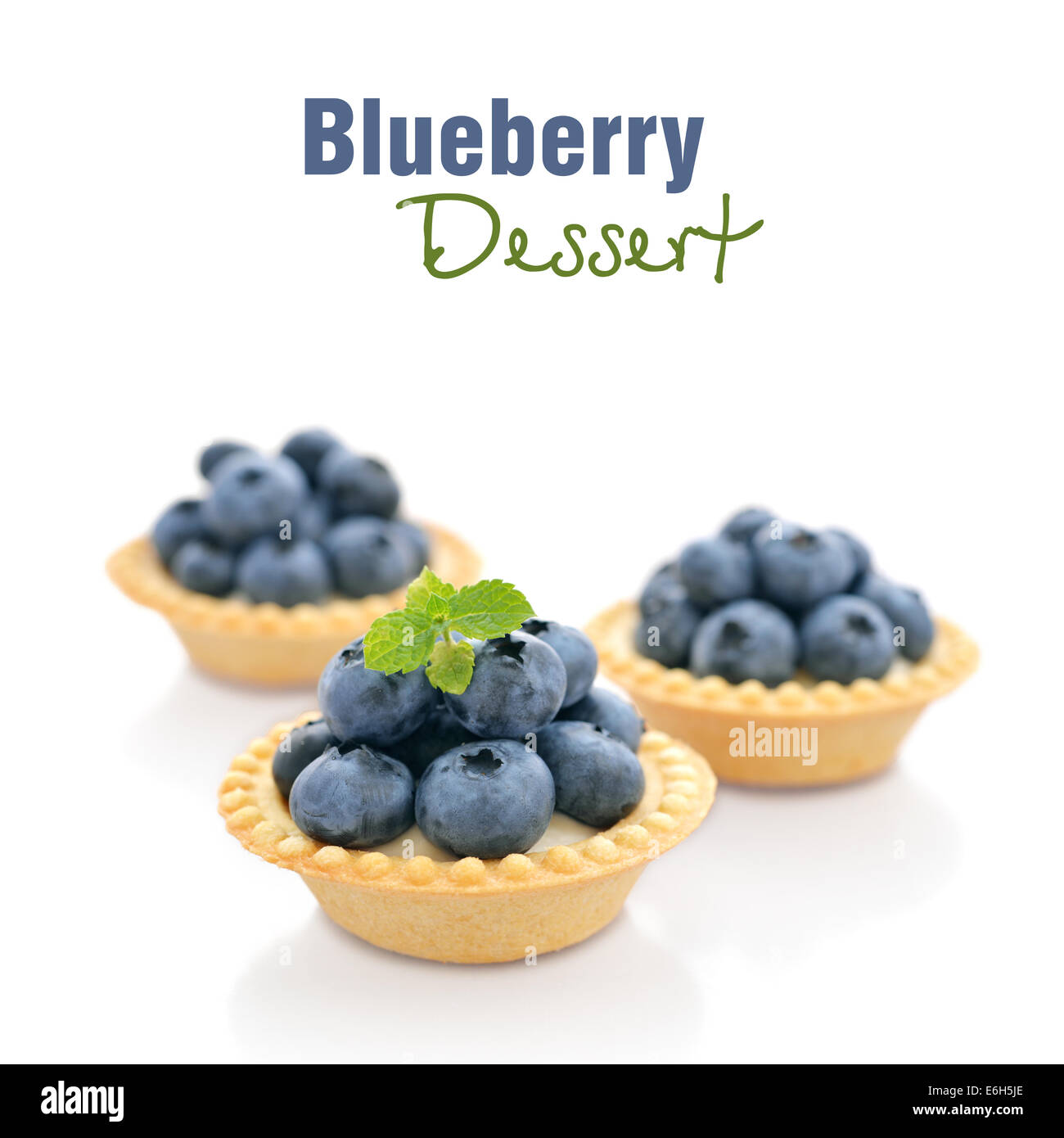 Delicious mini tart with fresh blueberries isolated on white Stock Photo