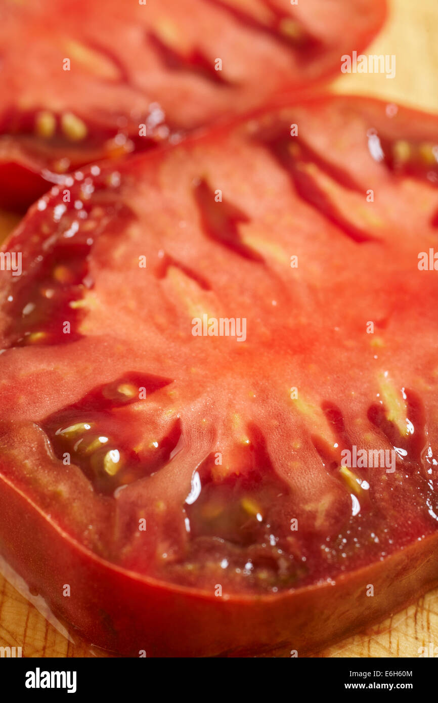 Sliced red heirloom tomatoes Stock Photo