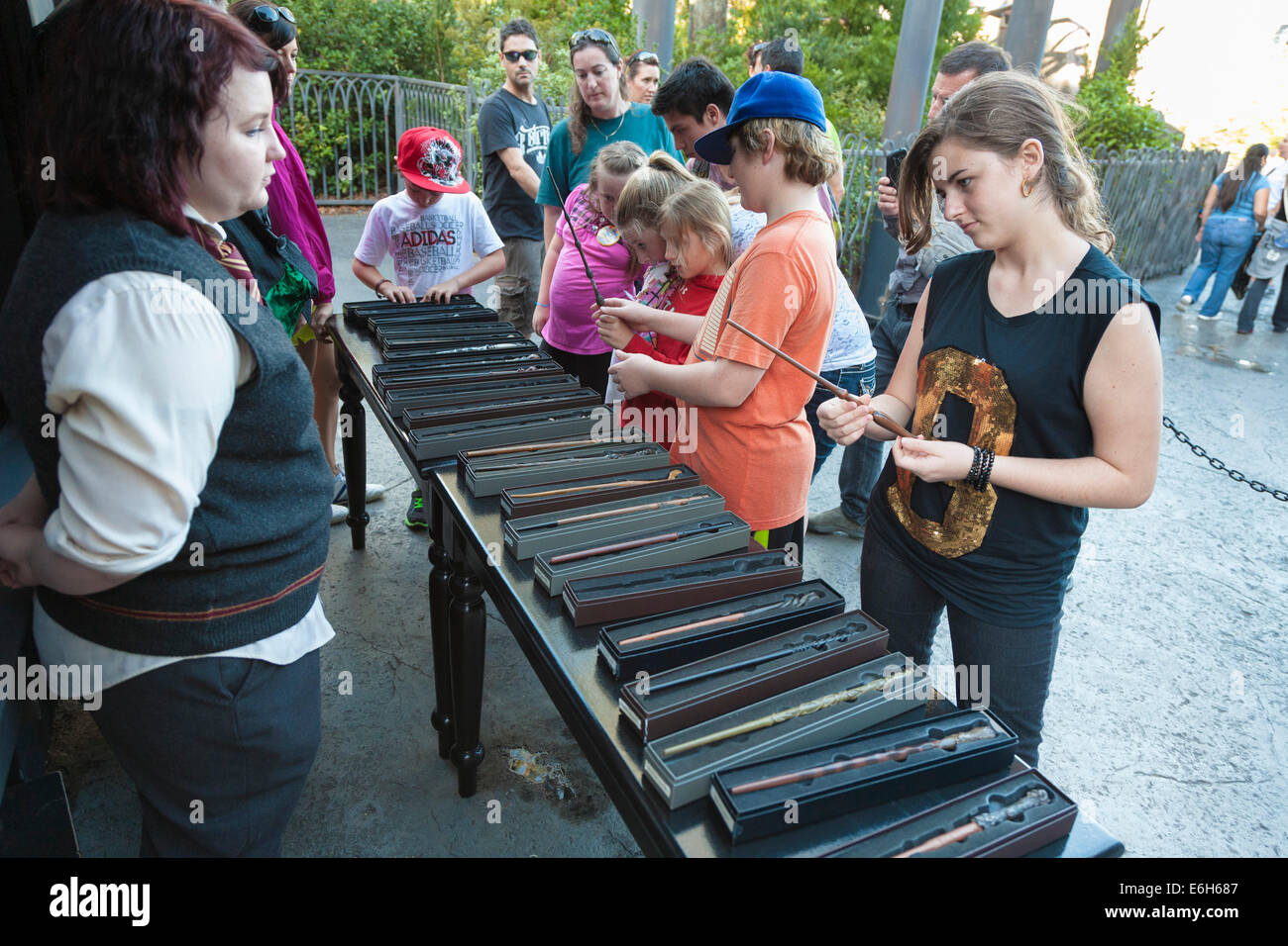 Park guests shopping for magic wands in The Wizarding World of Harry Potter at Universal Studios Islands of Adventure Stock Photo