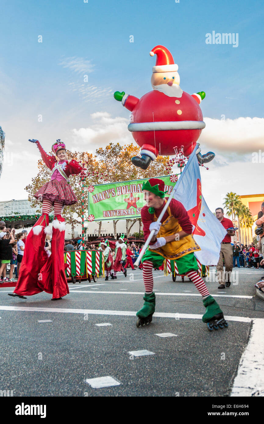 Roller skater, stilt walker, and an inflatable Santa lead the Macy's