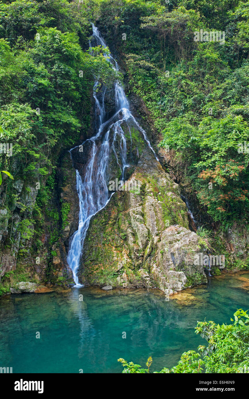 Beautiful seasonal waterfall cascading down the mountainside in the countryside outside of Guilin China Stock Photo