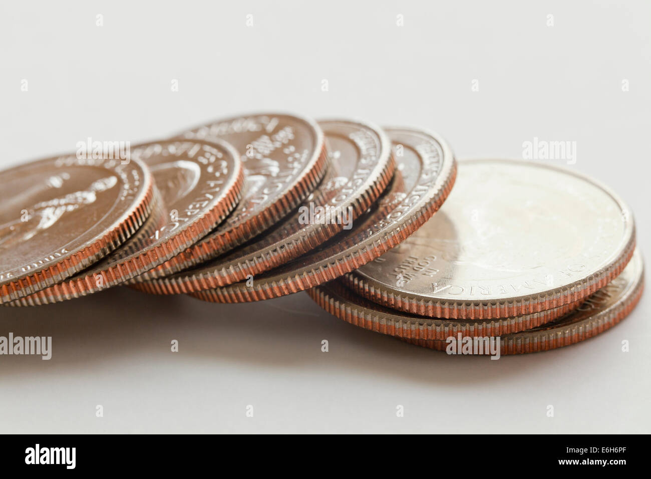 Fallen stack of US quarter dollar coins Stock Photo