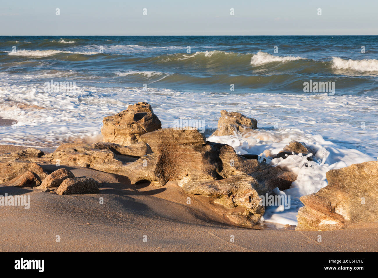 Coquina rock formations along coast of Atlantic Ocean at Washington Oaks Gardens State Park in Palm Coast, Florida, USA Stock Photo