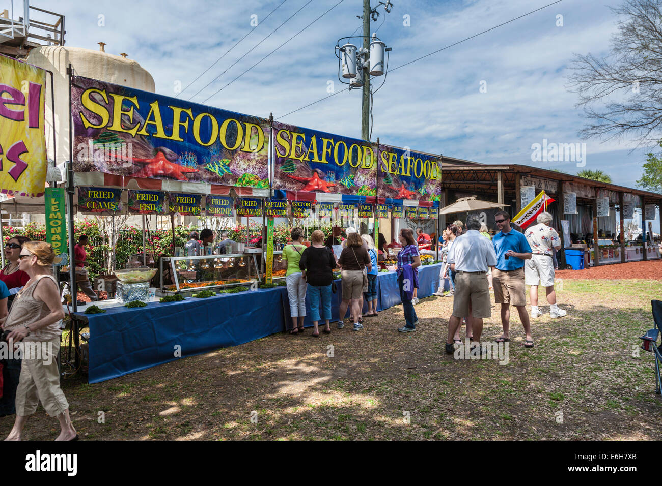 Guests sample seafood from concessionaires during Seafood Festival at