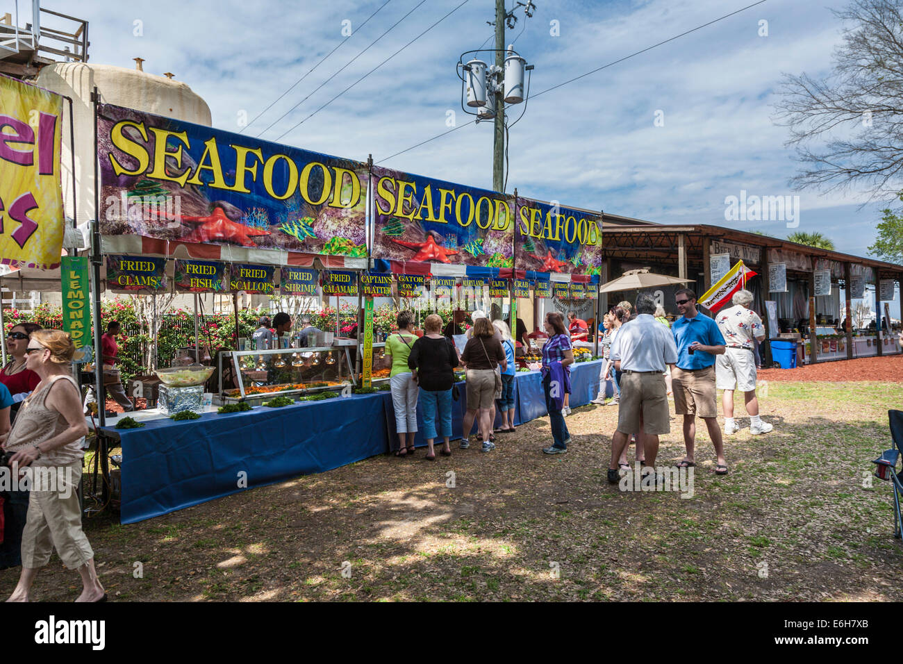 Guests sample seafood from concessionaires during Seafood Festival at Lakeridge Winery and Vineyards near Clermont, Florida Stock Photo