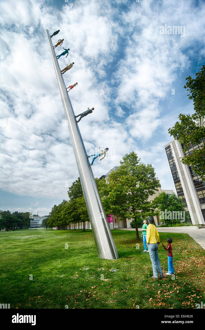 Carnegie Mellon University is home to “Walking To the Sky,” a stainless steel & resin artwork by CMU graduate Jonathan Borofsky. Stock Photo