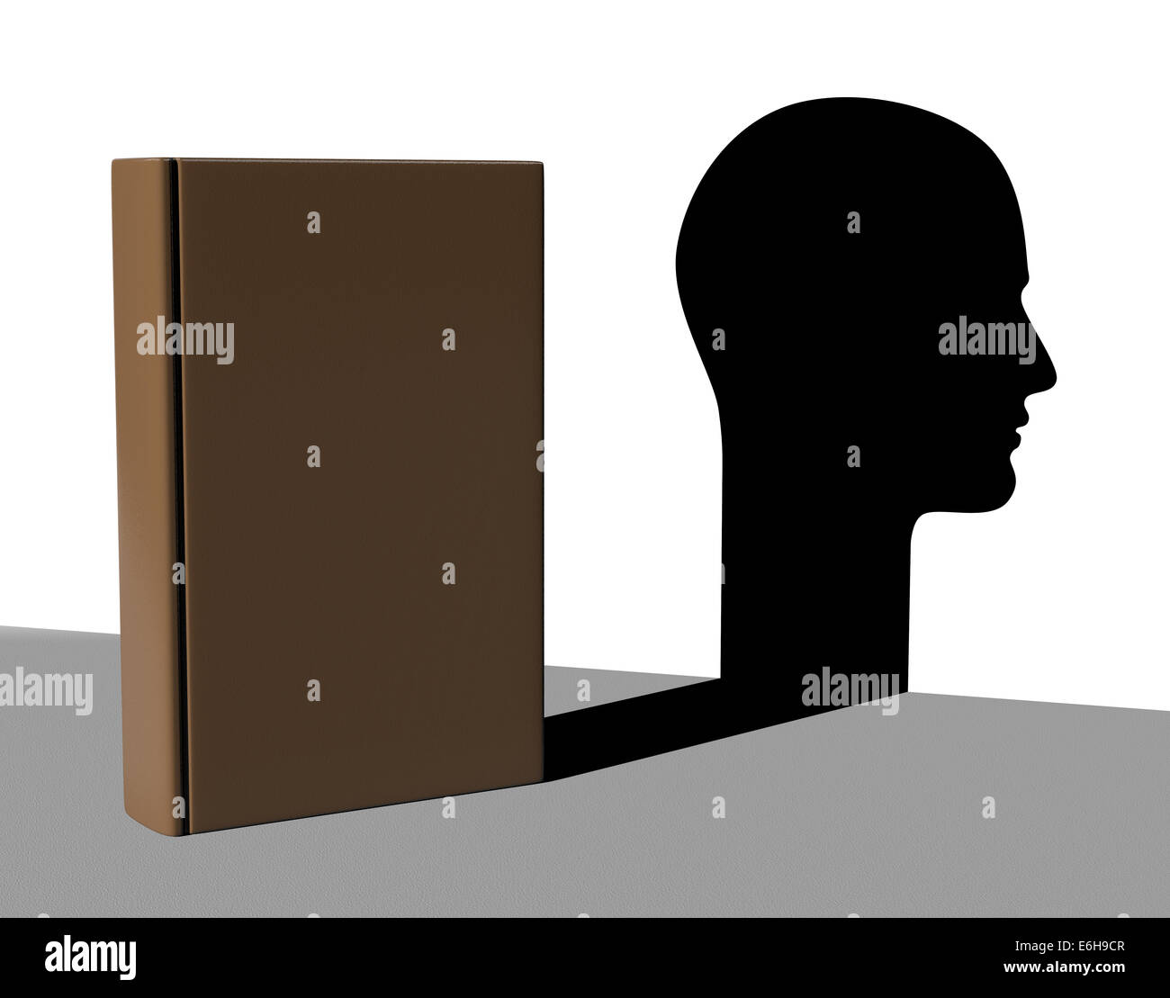 Book with Shadow in the Shape of an Human Head Stock Photo
