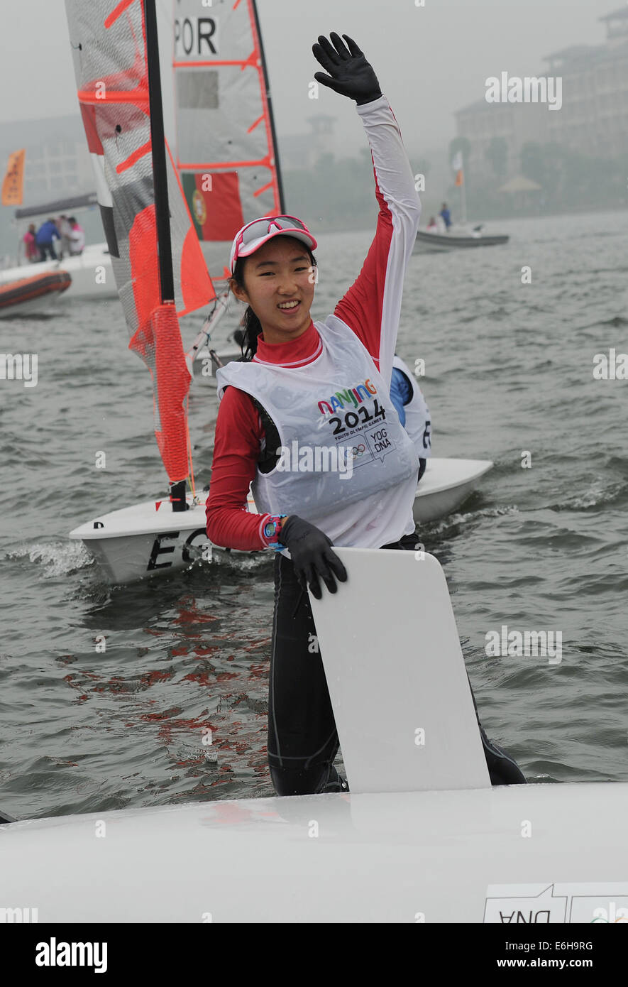 (SP)YOG-CHINA-NANJING-SAILING-WOMEN (140824) -- Samantha Yom of Singapore celebrates after the Byte CII- Women?s One Person Dinghy Final Race of Sailing at the Nanjing 2014 Youth Olympic Games in Nanjing, capital of east China's Jiangsu Province, on August 24, 2014. Samantha Yom won the gold medal. (Xinhua/Chen Cheng)(jyt) Stock Photo