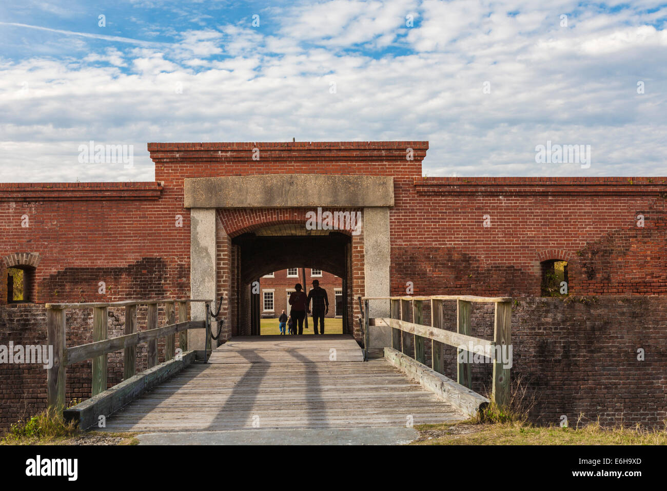 Silhouette of couple walking through entrance tunnel of Fort Clinch in Fort Clinch State Park at Fernandina Beach, Florida Stock Photo