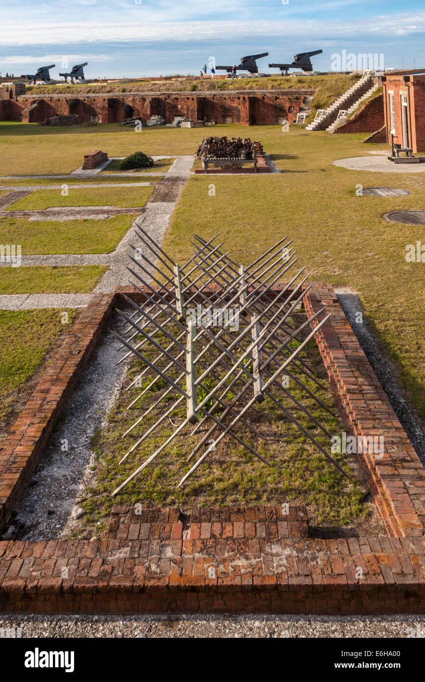 Cannons on wall beyond a 'cheval de frise' barrier at Fort Clinch in Fort Clinch State Park at Fernandina Beach, Florida Stock Photo