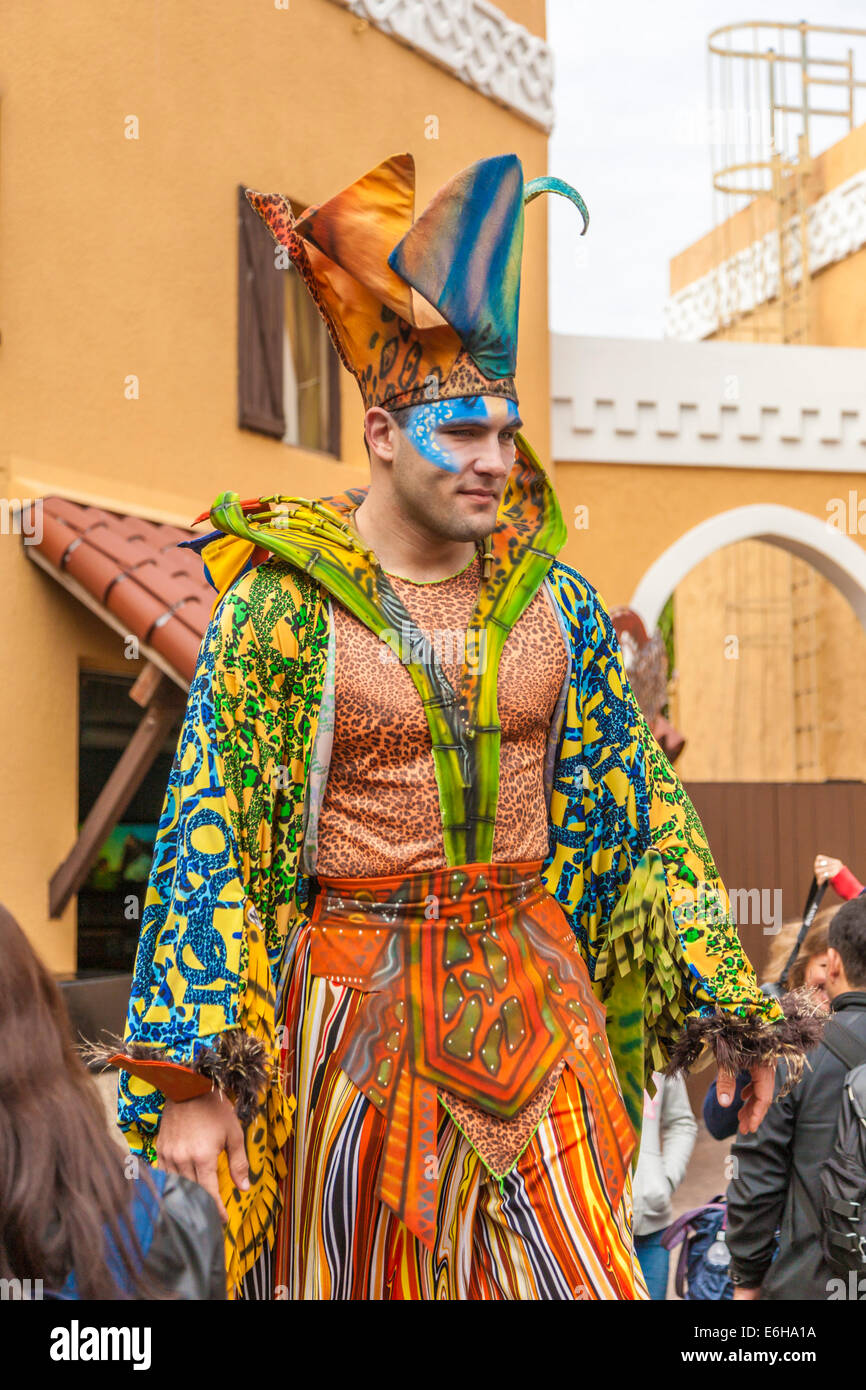 Stilt walker dressed as a jester near entrance to Busch Gardens in