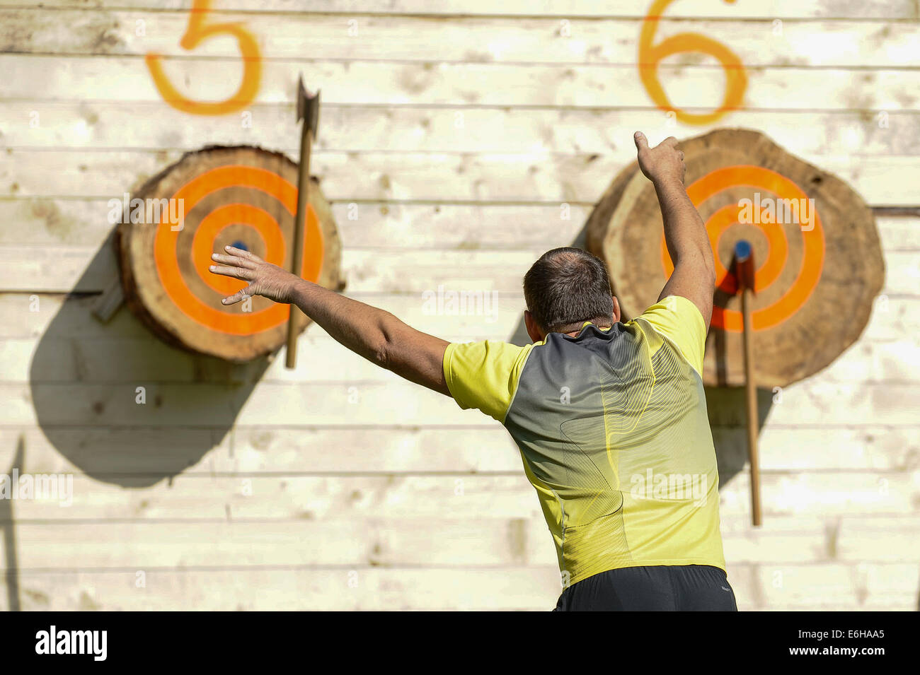 Maetaguse, Estonia. 23rd Aug, 2014. A player competes in the Nordic axe throwing championship in Maetaguse, Estonia, on Aug. 23, 2014. More than 100 best axe throwers from Denmark, Sweden, Finland and Estonia compete in the Nordic axe throwing championship, which lasts from 22 to 23 of August. © Sergei Stepanov/Xinhua/Alamy Live News Stock Photo
