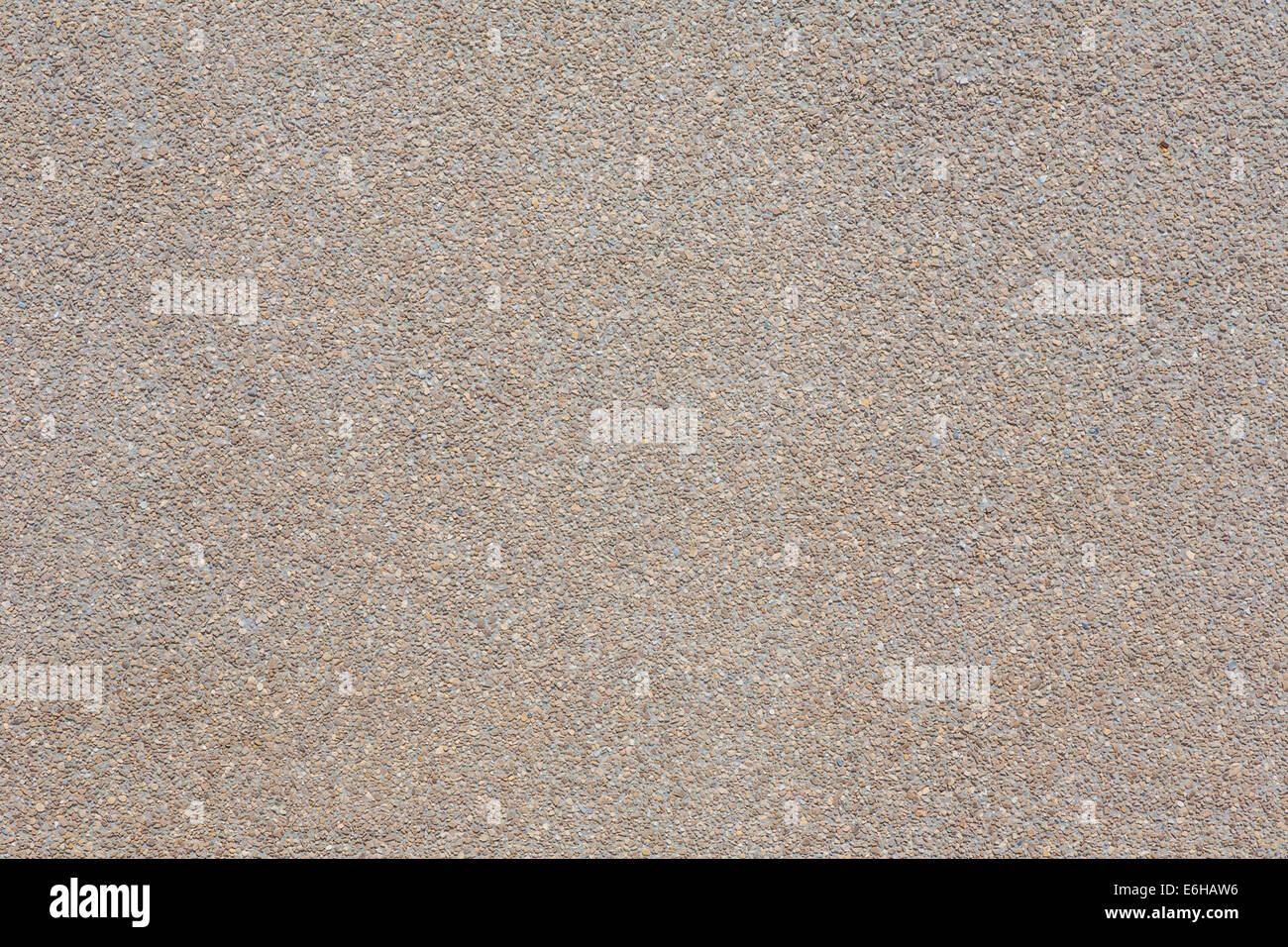 Close up of exposed aggregate concrete wall panel with brown colored concrete Stock Photo