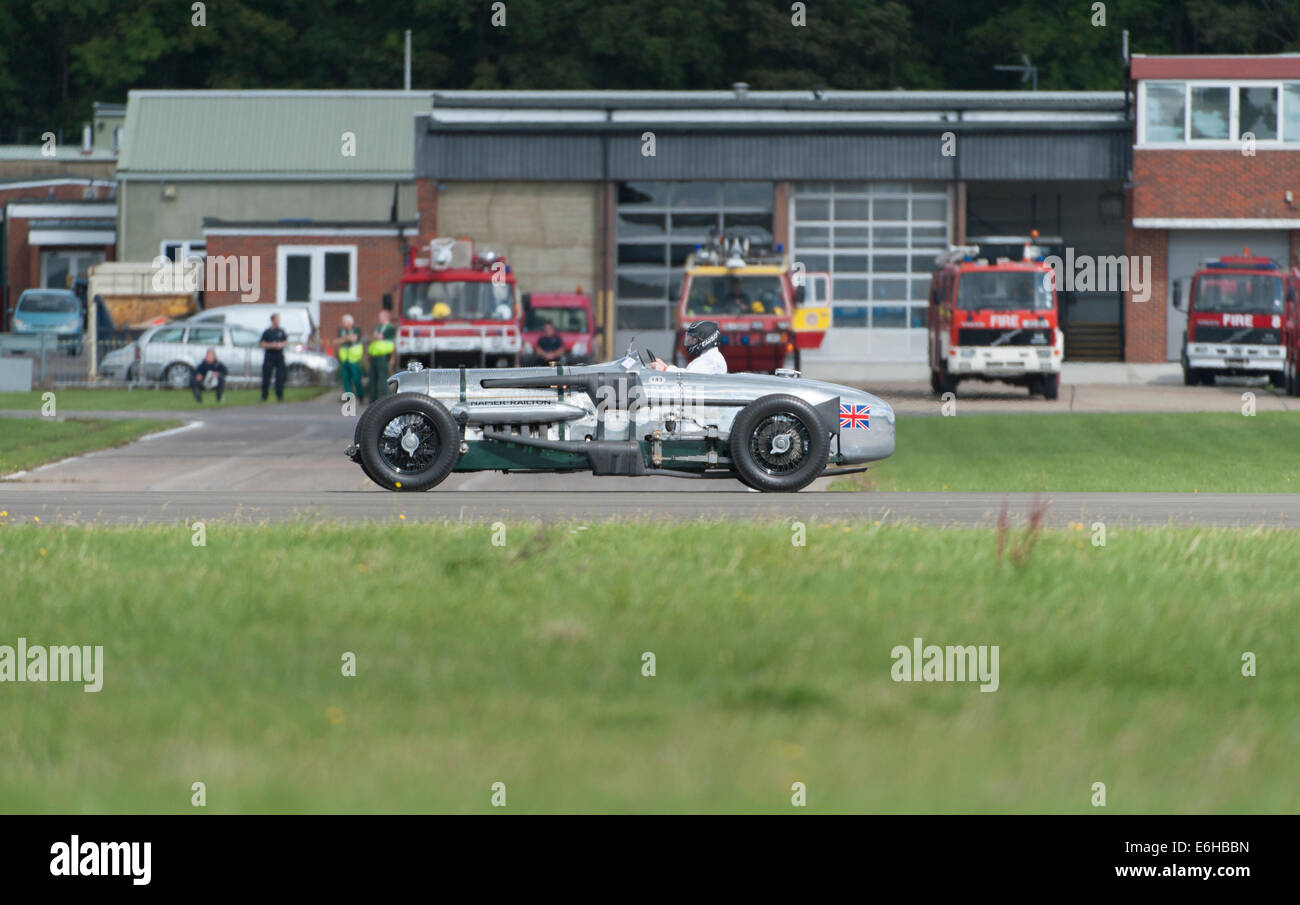 Dunsfold Aerodrome, Surrey UK. Saturday 23rd August 2014. The Napier-Railton on a fast run down the runway at the 10th Dunsfold Wings and Wheels. The fastest car ever around the Brooklands Outer Circuit (John Cobb’s lap at an average speed of 143.44mph in 1935 stands in perpetuity). The car has a 24 litre, 12 cylinder Napier Lion aircraft engine. Credit:  Malcolm Park editorial/Alamy Live News. Stock Photo