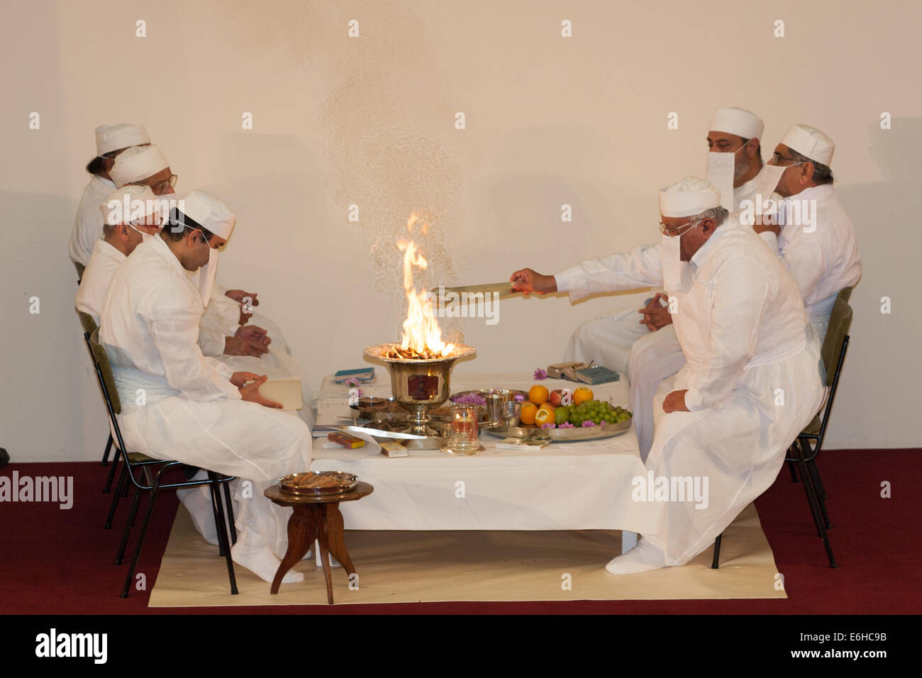 Priests burning sandalwood during the Zoroastrian Jashan ceremony Stock Photo