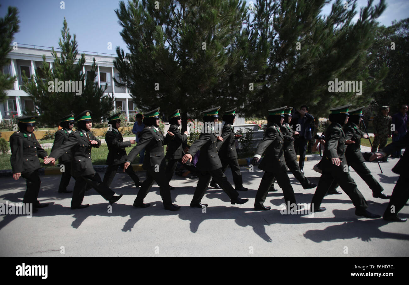 Kabul, Afghanistan. 24th Aug, 2014. Newly-graduated female Afghan National Army (ANA) officers march during the graduation ceremony in Kabul, Afghanistan on Aug. 24, 2014. A total of 30 female army officers graduated from Kabul Military Training Center (KMTC) on Sunday and commissioned to ANA, General Aminullah Paktiani commander of KMTC said. Credit:  Ahmad Massoud/Xinhua/Alamy Live News Stock Photo