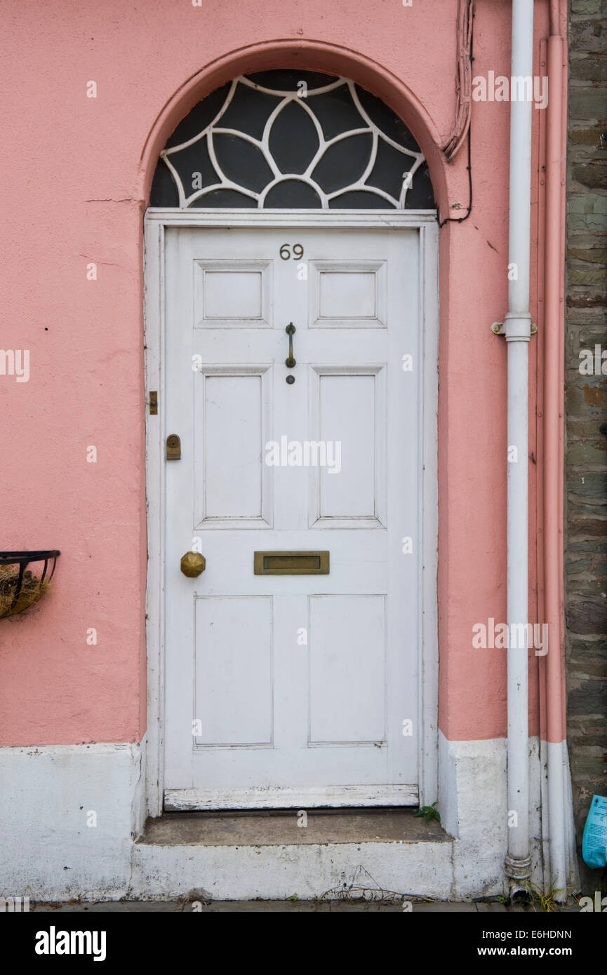 White number 69 wooden front door of period terraced house in Brecon Powys Wales UK Stock Photo