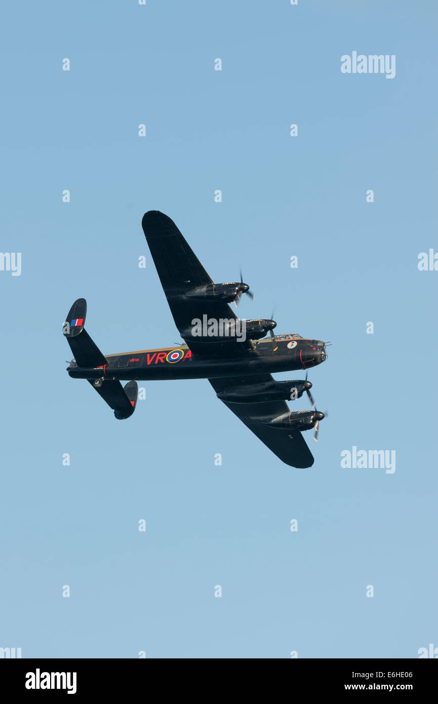 Battle of Britain Memorial Flight with the Avro Lancaster from Canadian Warplane Heritage Museum 'Vera' at the Dawlish Air Show. Stock Photo