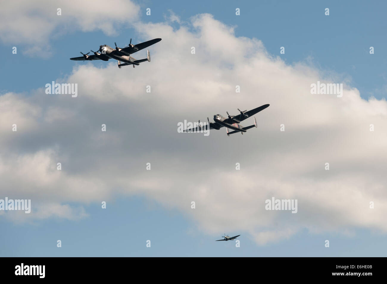 Battle of Britain Memorial Flight with Avro Lancasters PA474 'Thumper' and the Canadian Warplane Heritage Museum's 'Vera', and Spitfire PS915 (Mk PRXIX) at the Dawlish Air Show. Stock Photo