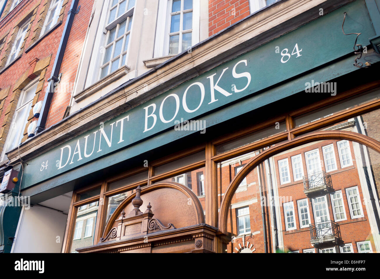 Daunt Books Independent travel bookshop Marylebone High Street London England UK Buildings opposite reflected in window Stock Photo