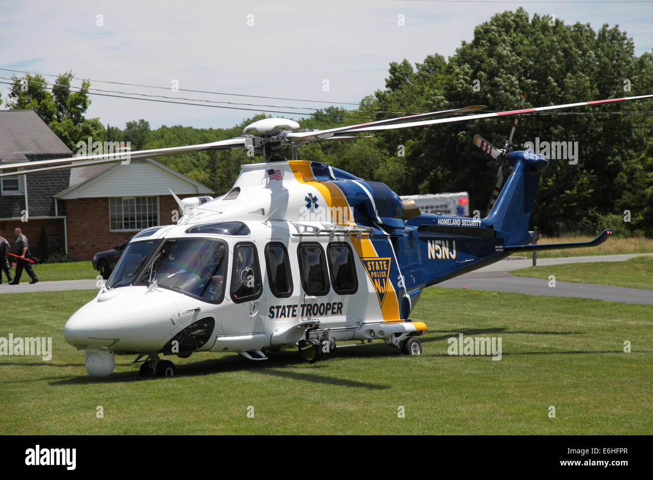 New Jersey State Police Medical Evacuation Helicopter arrives to airlift a  motorcyclist to hospital after accident Stock Photo - Alamy