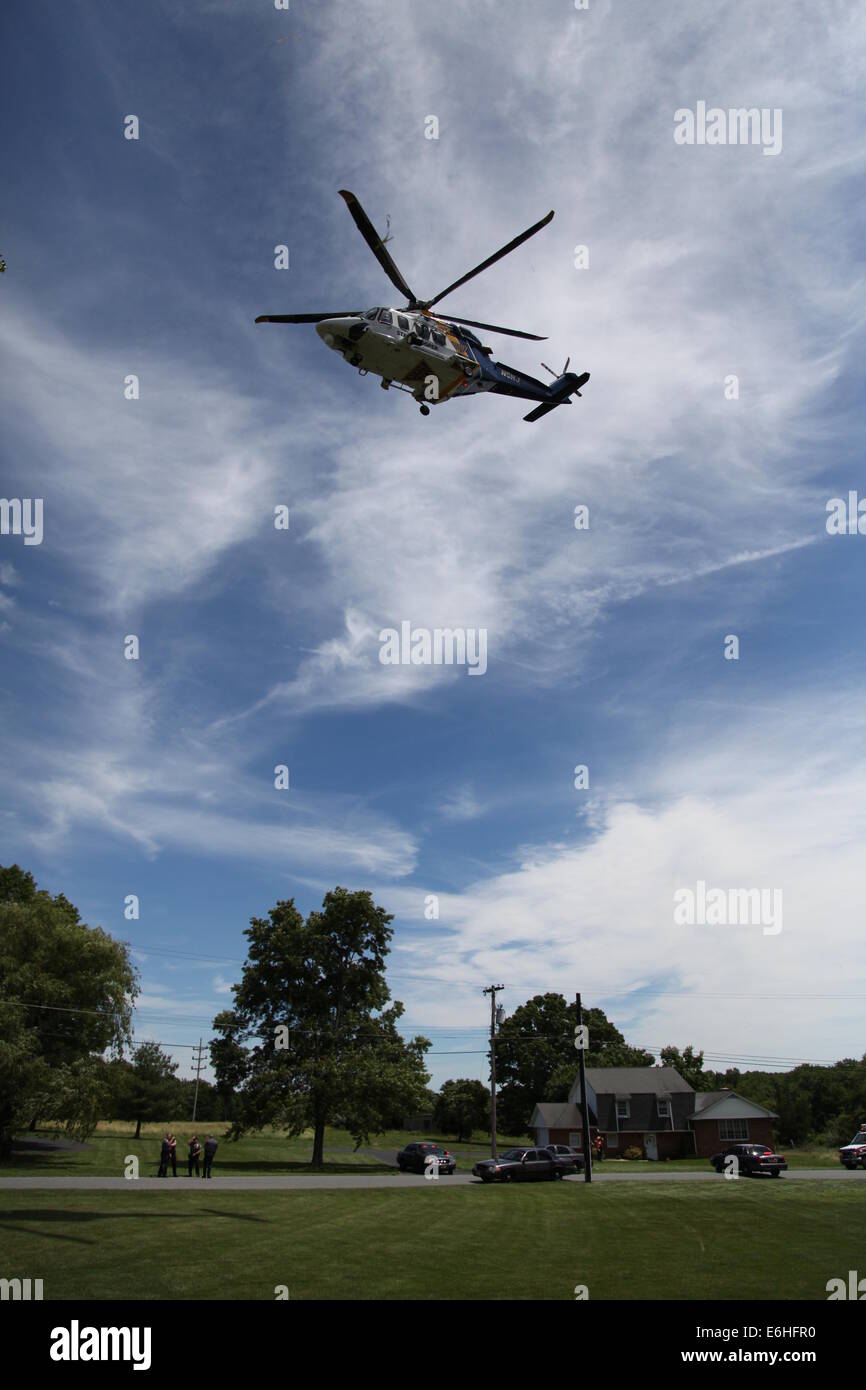 New Jersey State Police Medical Evacuation Helicopter arrives to airlift a motorcyclist to hospital after accident Stock Photo