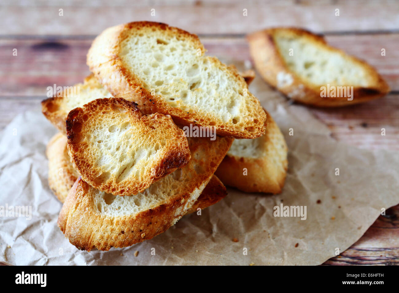 baguette slices dried in the oven, food closeup Stock Photo