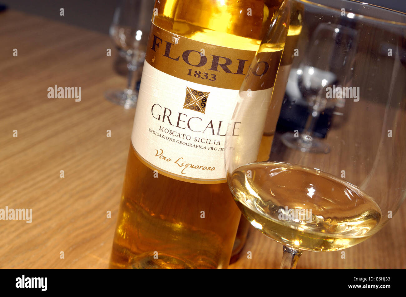 A bottle of Moscato wine with a glass, Marsala, Sicily Stock Photo