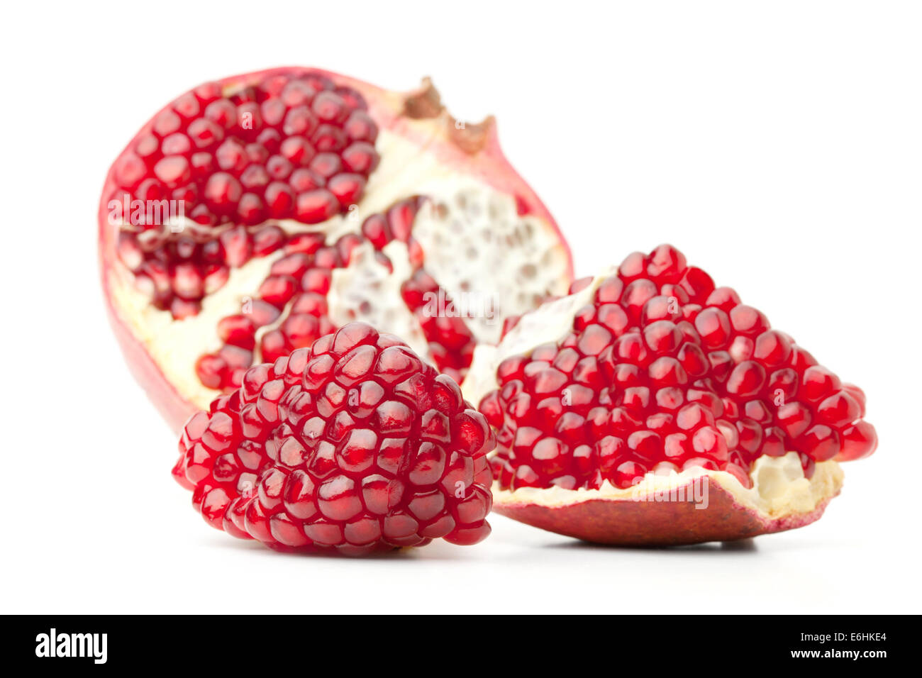 Red pomegranate fruit. Small DOF. Isolated on white background Stock Photo