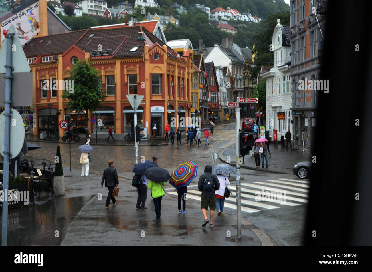 A rainy day in Bergen. It had been raining heavily all day, umbrellas were not much good against it.Seen from top of bus.Stalls Stock Photo