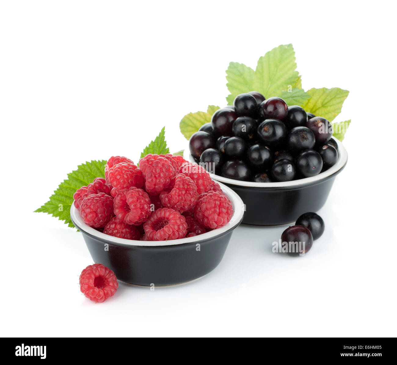 Black currant and raspberry. Isolated on white background Stock Photo ...