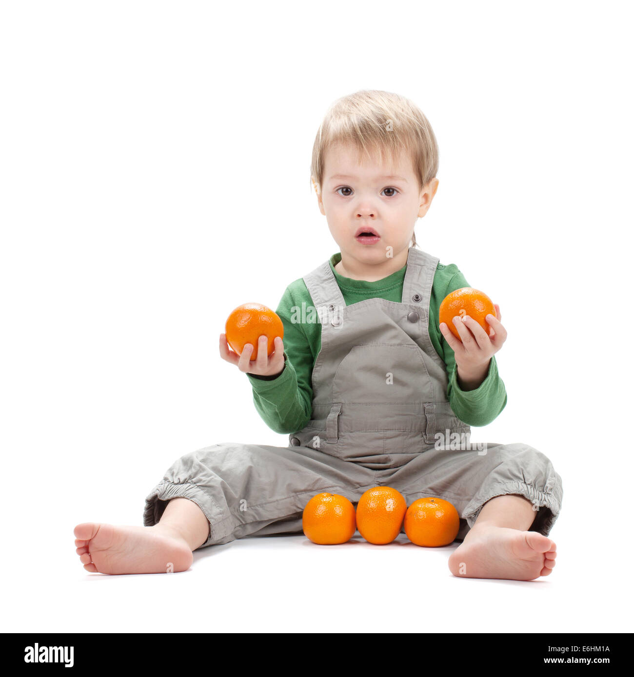 Baby with oranges. Isolated on white background Stock Photo Alamy