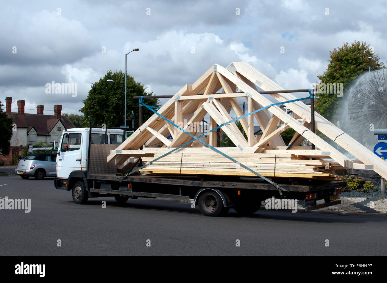 A lorry carrying timber roof frames, Nuneaton, Warwickshire, UK Stock Photo