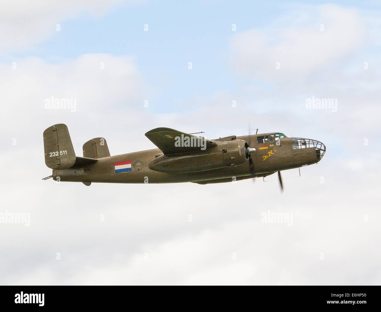 Dunsfold, UK. 23rd Aug, 2014. Royal Netherlands Air Force B-25 North American Mitchell World War 2 USAAF medium bomber aircraft flying at Wings and Wheels air show at Dunsfold Surrey on Saturday 23rd August Credit:  Niall Ferguson/Alamy Live News Stock Photo