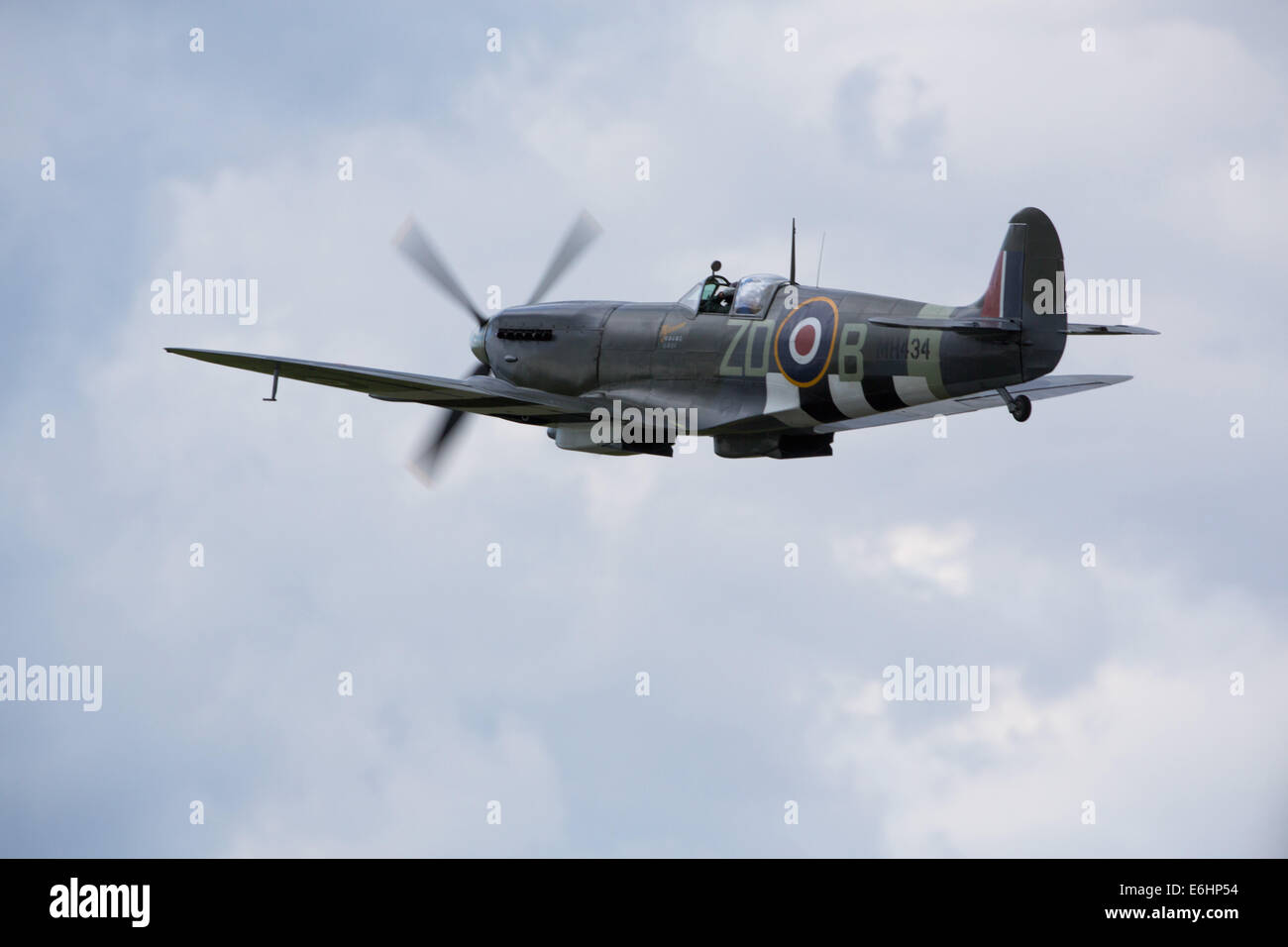 Dunsfold, UK. 23rd Aug, 2014. Supermarine Spitfire Mk IXB World War 2 fighter aircraft seen here was built in 1943 and was flown in action by South African, Flt. Lt. Henry Lardner-Burke, of 222 Squadron,  who scored seven and a half victories and three damaged. This Spitfire also served with the Royal Netherlands Air Force  and with the Belgian Air Force. In 1956 it became a civilian and returned to the UK. Ray Hanna bought MH-434 in 1983,  and the Old Flying Machine Company was born. Credit:  Niall Ferguson/Alamy Live News Stock Photo