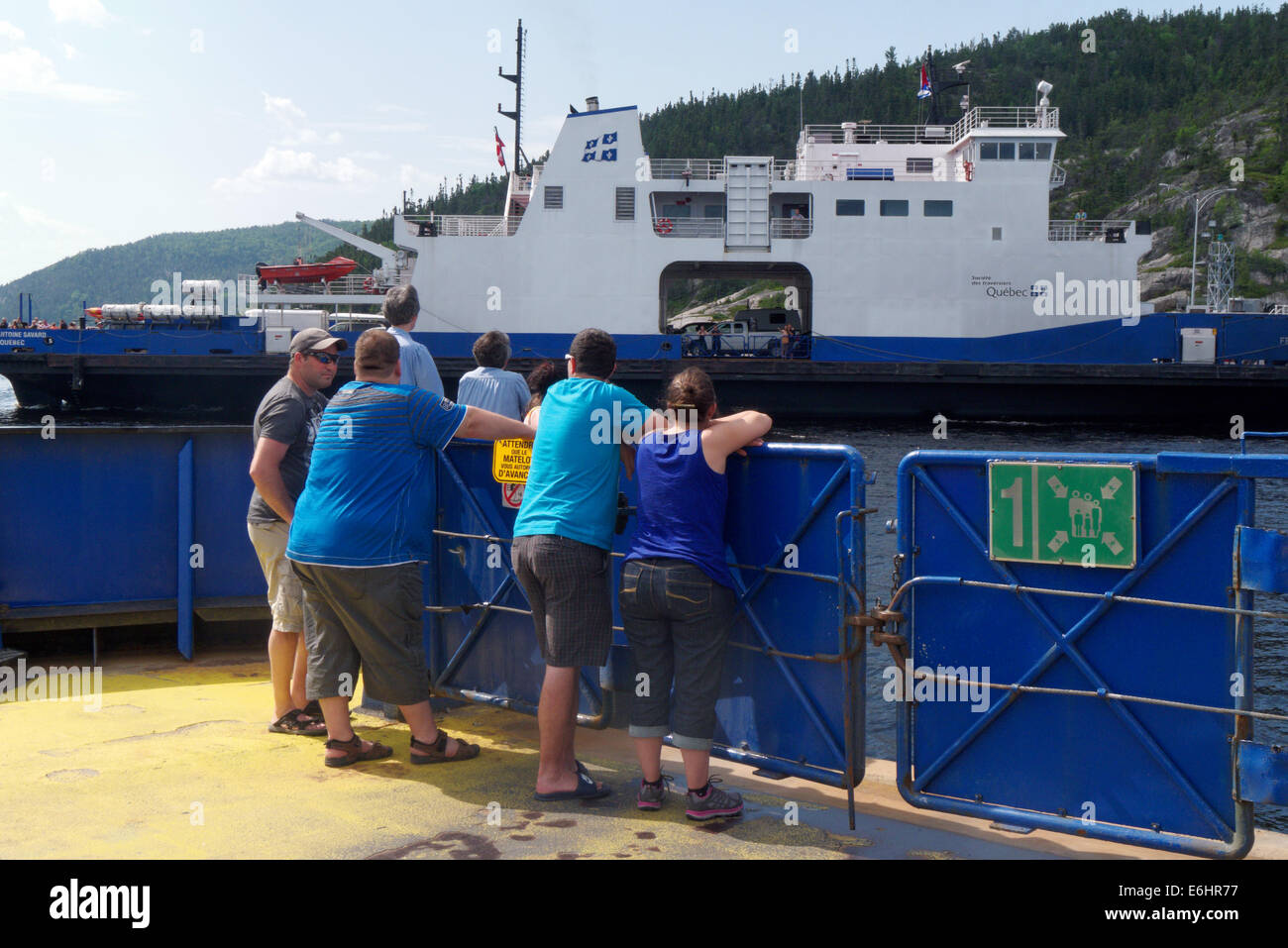 Passengers on the Baie Ste Catherine to Tadoussac ferry crossing the