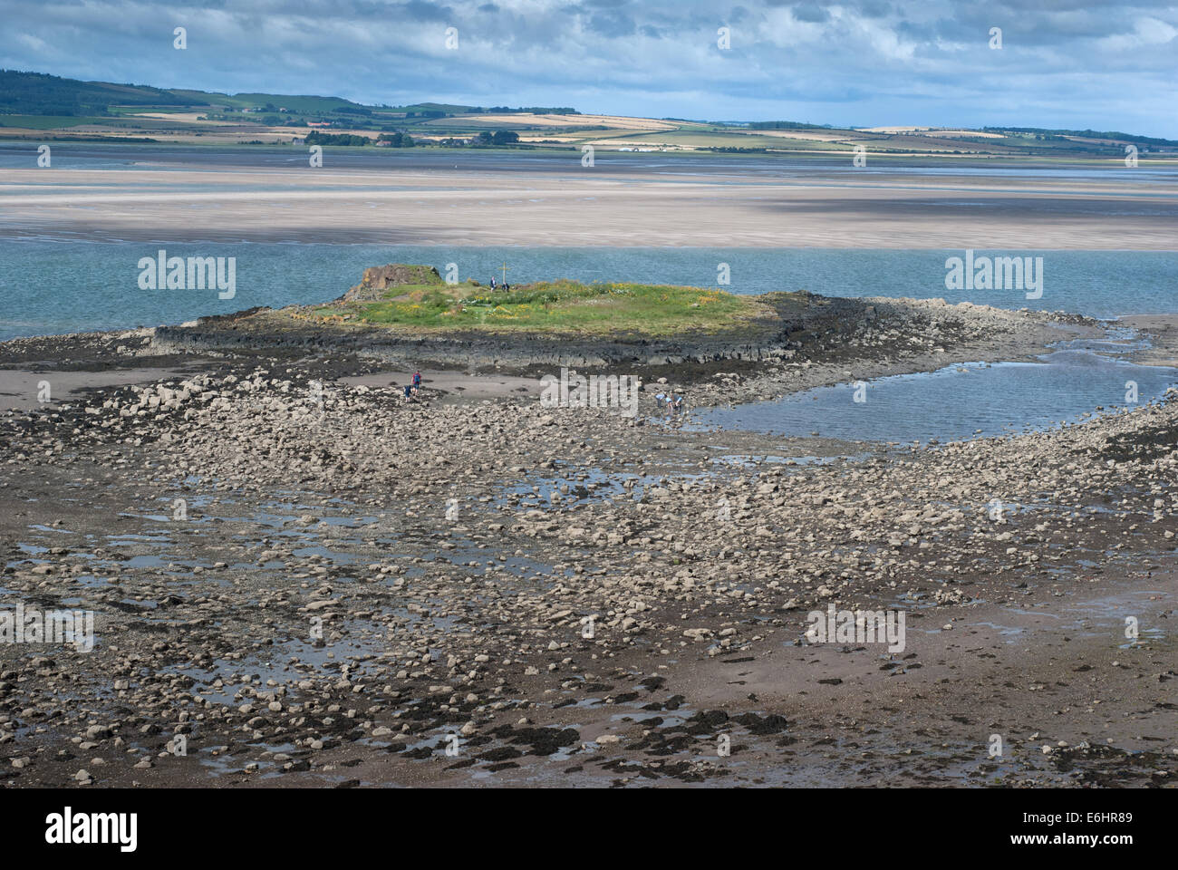 Remains of the chapel on St Cuthbert s Island Holy Island Lindi Stock
