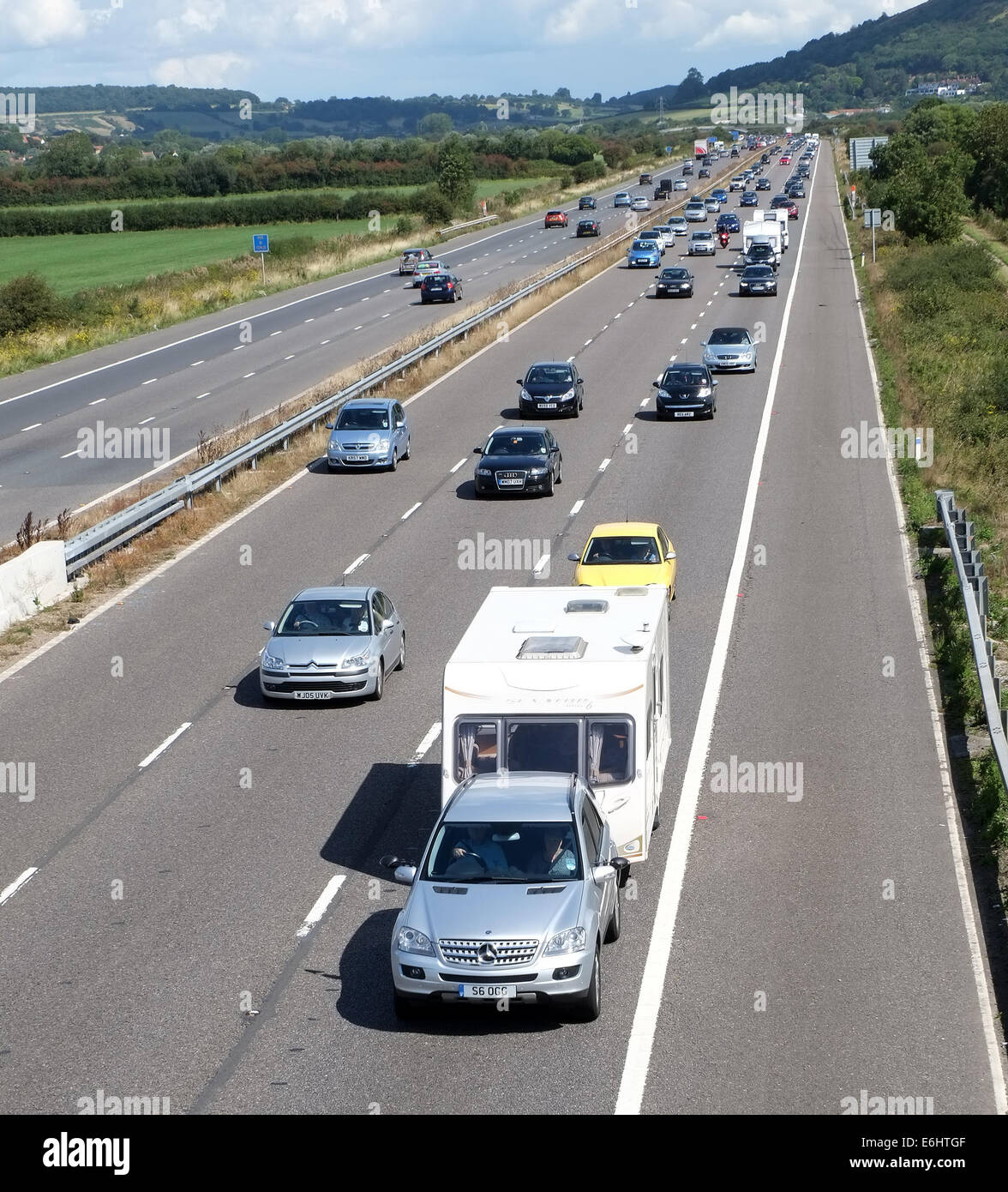 Busy bank holiday traffic on the M5 motorway heading down South West,  many caravans in the slow traffic. 23rd August 2015 Stock Photo
